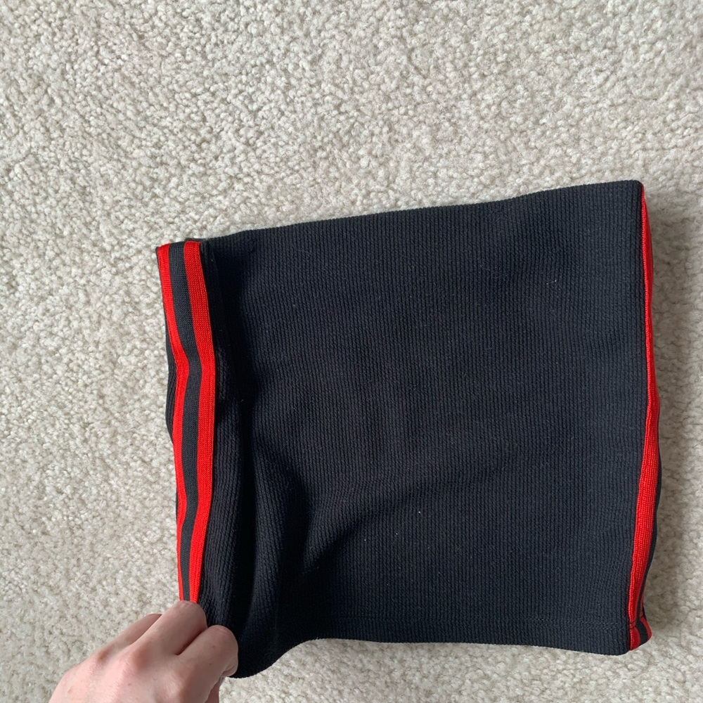 Red side stripe detail, black strapless top